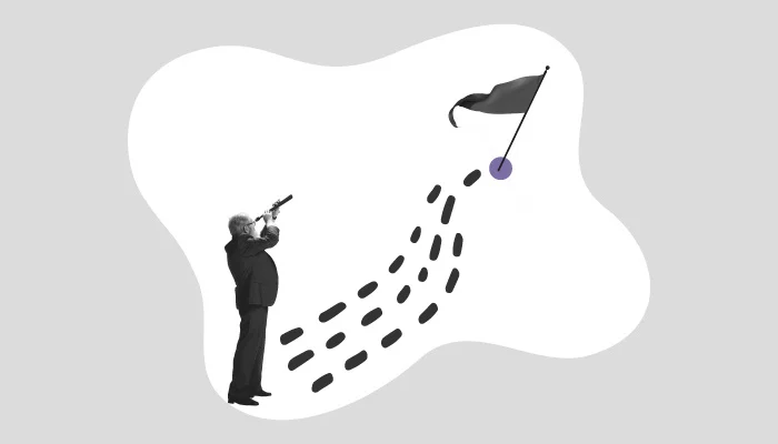 Um homem olha para uma bandeira por meio de uma luneta.