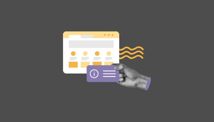 Uma mão segura um cartão de visita em frente a uma página da web.